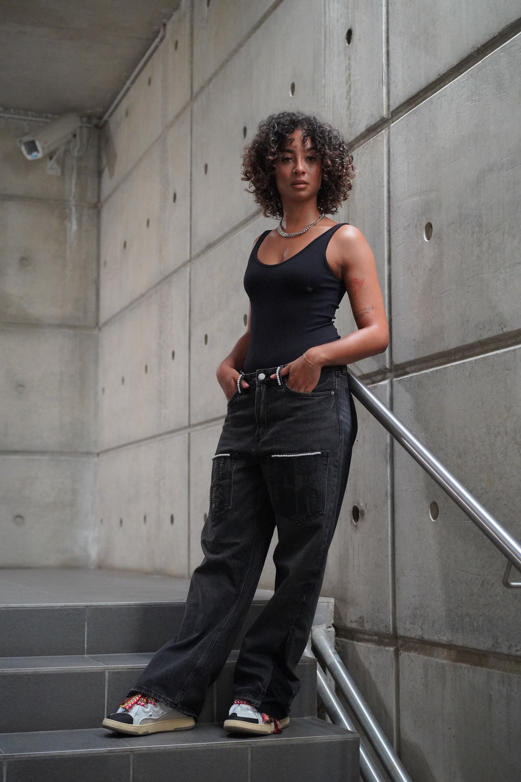 BLACK FLARED DENIM WITH PEARLS AND PATCHWORK